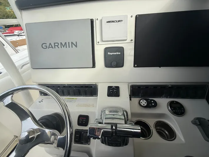 Loretta II Yacht Photos Pics 2012 Boston Whaler 320 Outrage helm with Garmin and Raymarine electronics.