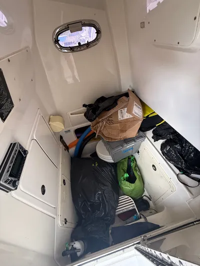 Loretta II Yacht Photos Pics Interior of a 2012 Boston Whaler 320 Outrage with storage items.