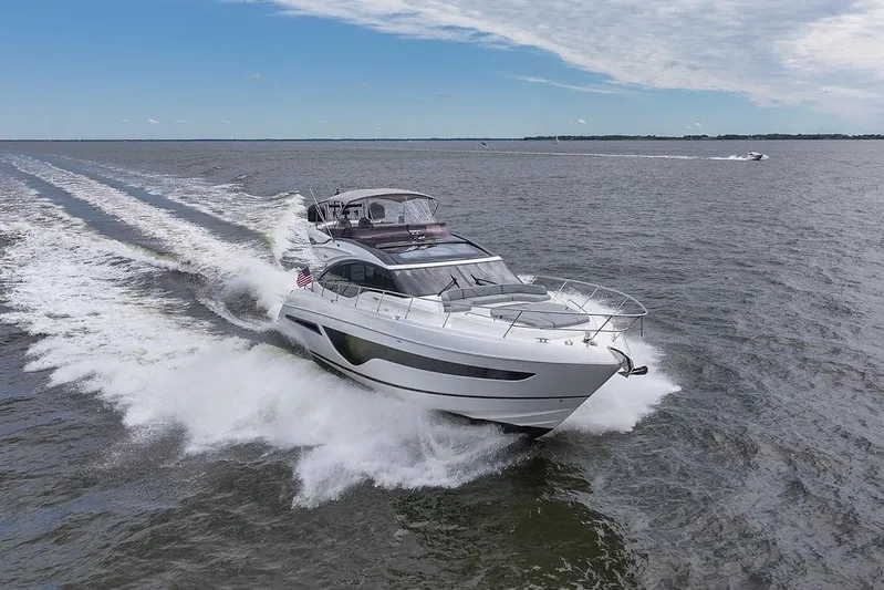  Yacht Photos Pics 2020 Princess S66 yacht cruising on open water under a clear sky.