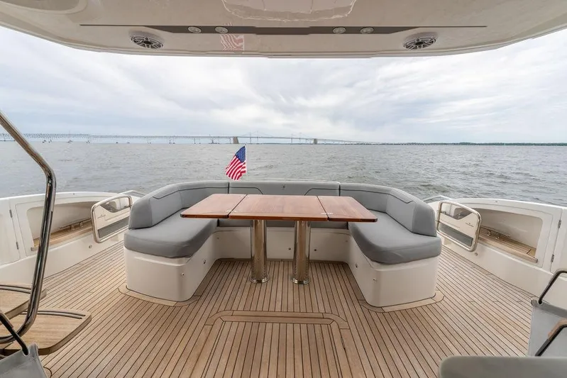  Yacht Photos Pics Luxurious 2020 Princess S66 yacht deck with seating, table, and ocean view.