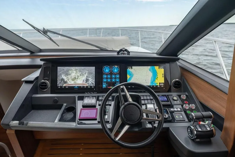  Yacht Photos Pics Cockpit of 2020 Princess S66 yacht with advanced navigation displays and controls.