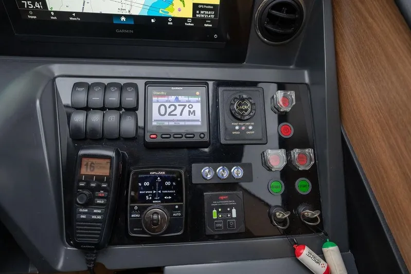  Yacht Photos Pics Control panel of a 2020 Princess S66 yacht with navigation and communication equipment.