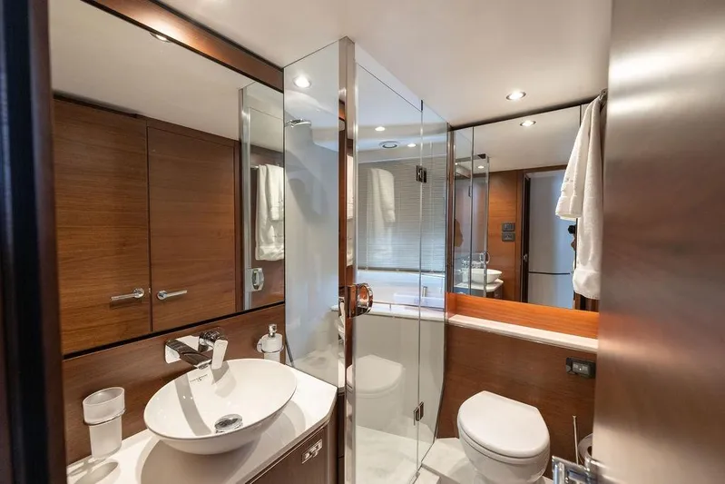  Yacht Photos Pics Luxurious bathroom in 2020 Princess S66 yacht with modern fixtures and wooden accents.