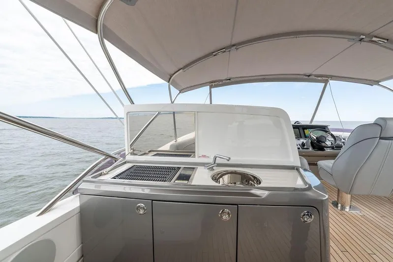  Yacht Photos Pics Luxurious 2020 Princess S66 yacht deck with outdoor kitchen and seating area.