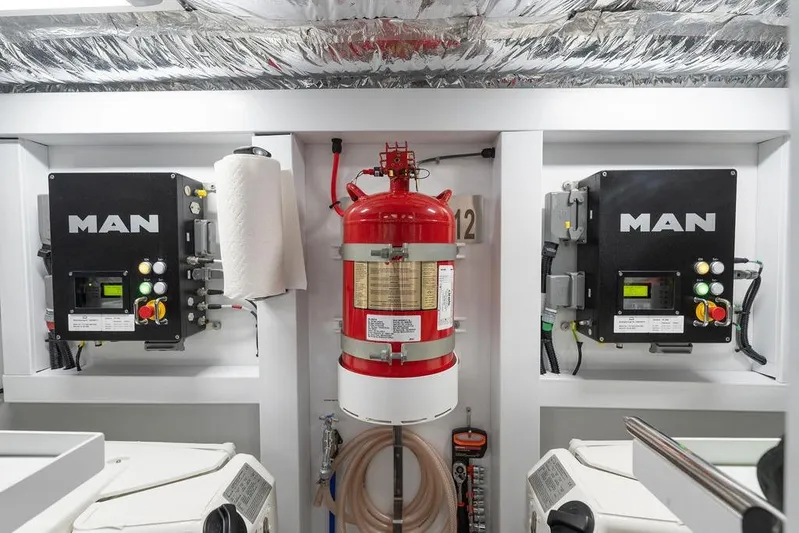 Yacht Photos Pics Engine room of 2020 Princess S66 yacht with MAN control panels and fire extinguisher.