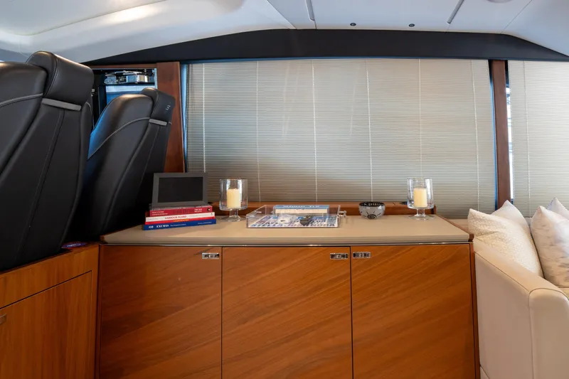  Yacht Photos Pics Luxurious interior of 2020 Princess S66 yacht with elegant wood cabinetry and modern decor.