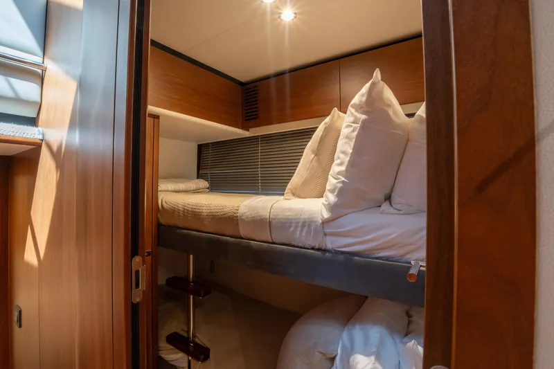  Yacht Photos Pics Luxurious cabin interior of 2020 Princess S66 yacht with cozy bedding.