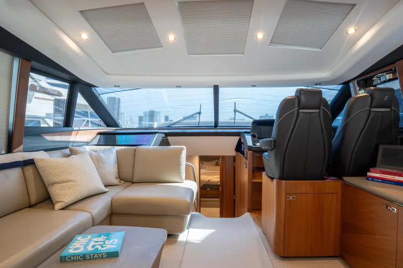  Yacht Photos Pics Luxurious interior of 2020 Princess S66 yacht with plush seating and modern helm.