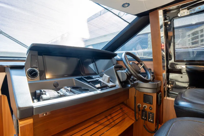  Yacht Photos Pics Luxurious 2020 Princess S66 yacht helm with modern controls and sleek design.