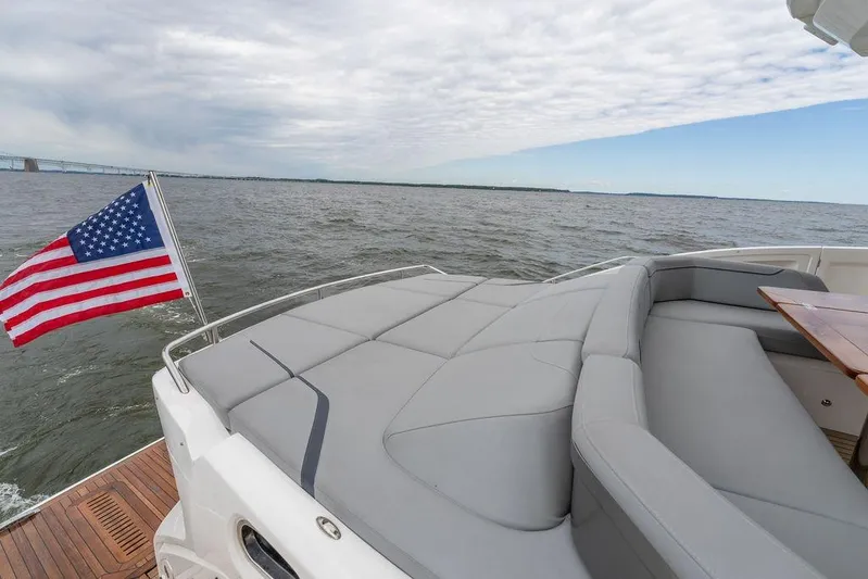  Yacht Photos Pics Luxury 2020 Princess S66 yacht with American flag, spacious deck, and ocean view.