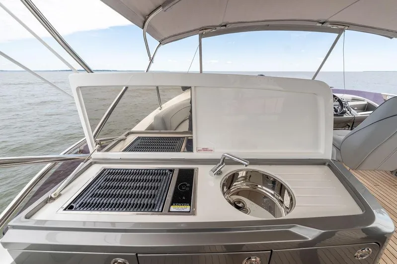  Yacht Photos Pics Luxury yacht Princess S66 2020 with outdoor kitchen and sink, overlooking the ocean.