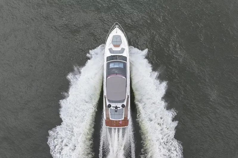  Yacht Photos Pics Aerial view of 2020 Princess S66 yacht cruising on open water.