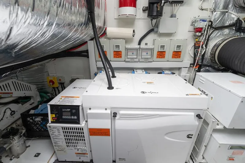  Yacht Photos Pics Engine room of 2020 Princess S66 yacht with Onan generator and control panels.