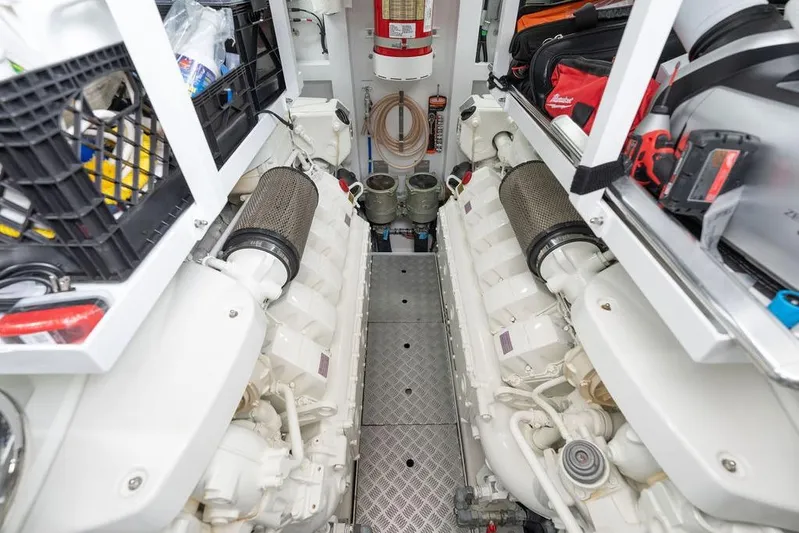  Yacht Photos Pics Engine room of 2020 Princess S66 yacht, featuring dual engines and organized storage.