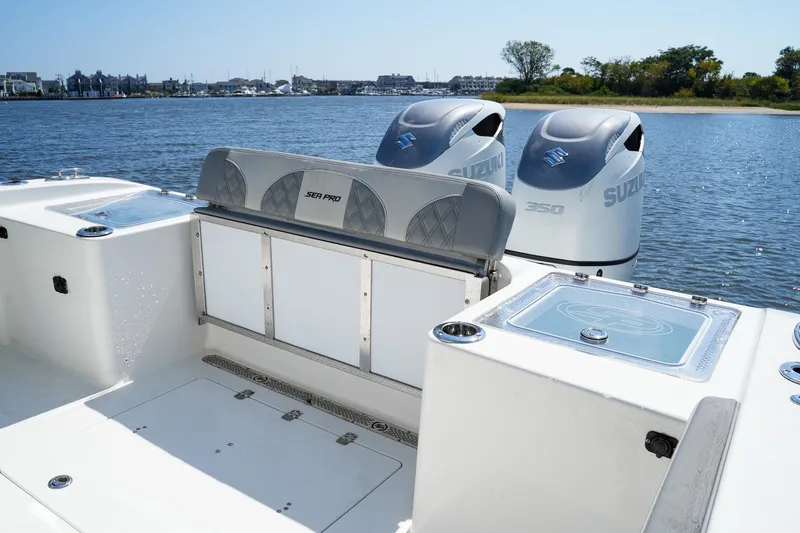  Yacht Photos Pics 2021 Sea Pro 320 DLX Offshore boat with dual Suzuki 350 engines on a calm lake.