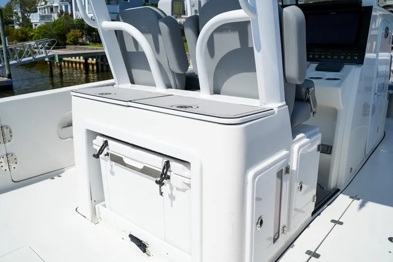  Yacht Photos Pics 2021 Sea Pro 320 DLX Offshore boat interior with seating and storage compartments.