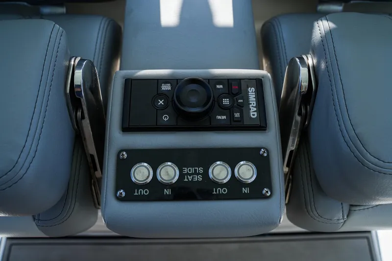  Yacht Photos Pics Control panel of 2021 Sea Pro 320 DLX Offshore boat with Simrad system and seat adjustment buttons.