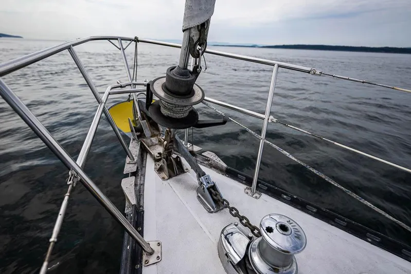 Koh - I - Noor Yacht Photos Pics Bow of a 1974 C&C 61 sailboat on calm waters.