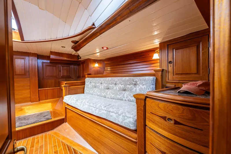 Koh - I - Noor Yacht Photos Pics Luxurious wooden interior of a 1974 C&C 61 yacht cabin with cozy seating.