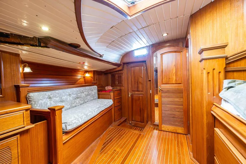 Koh - I - Noor Yacht Photos Pics Luxurious wooden interior of a 1974 C&C 61 yacht cabin with elegant furnishings.