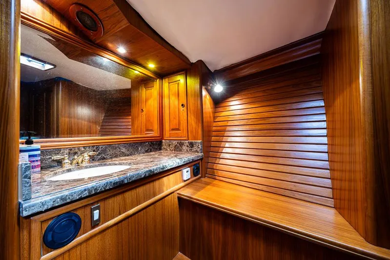 Koh - I - Noor Yacht Photos Pics Luxurious wooden interior of 1974 C&C 61 yacht bathroom with marble countertop.