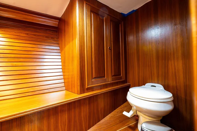 Koh - I - Noor Yacht Photos Pics Wood-paneled bathroom interior on a 1974 C&C 61 yacht.