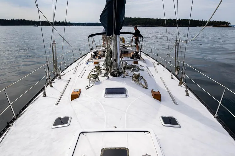 Koh - I - Noor Yacht Photos Pics 1974 C&C 61 sailboat on calm waters, featuring a spacious deck and serene surroundings.