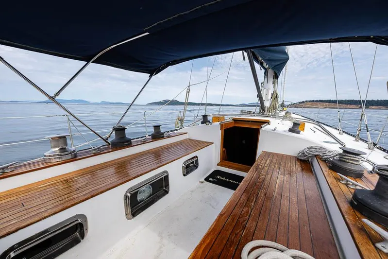 Koh - I - Noor Yacht Photos Pics 1974 C&C 61 sailboat deck with wooden benches and ocean view.