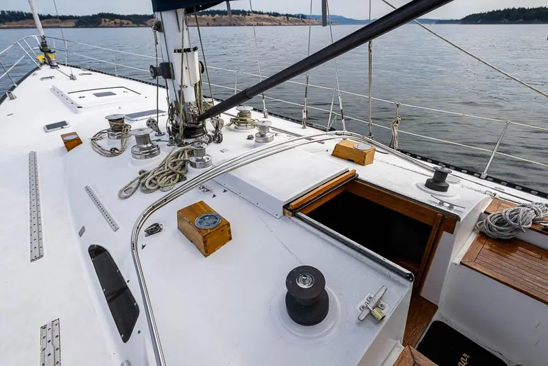 Koh - I - Noor Yacht Photos Pics 1974 C&C 61 sailboat deck with ropes and open hatch on calm water.