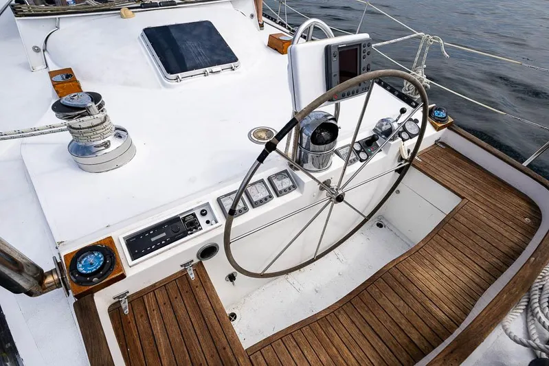 Koh - I - Noor Yacht Photos Pics 1974 C&C 61 sailboat cockpit with wooden deck and steering wheel.