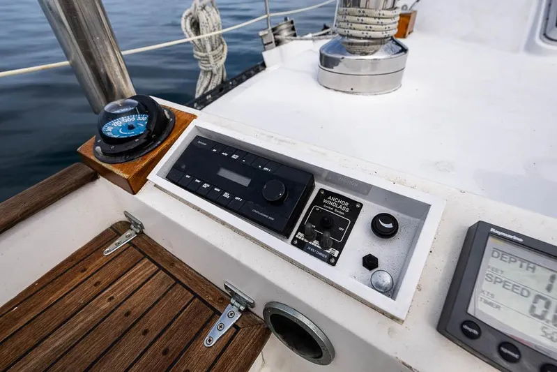 Koh - I - Noor Yacht Photos Pics Control panel on a 1974 C&C 61 sailboat, featuring navigation instruments and wooden deck.