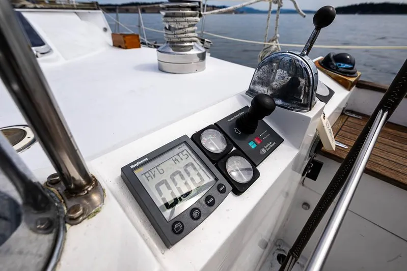 Koh - I - Noor Yacht Photos Pics Control panel on a 1974 C&C 61 sailboat, featuring navigation instruments and throttle.