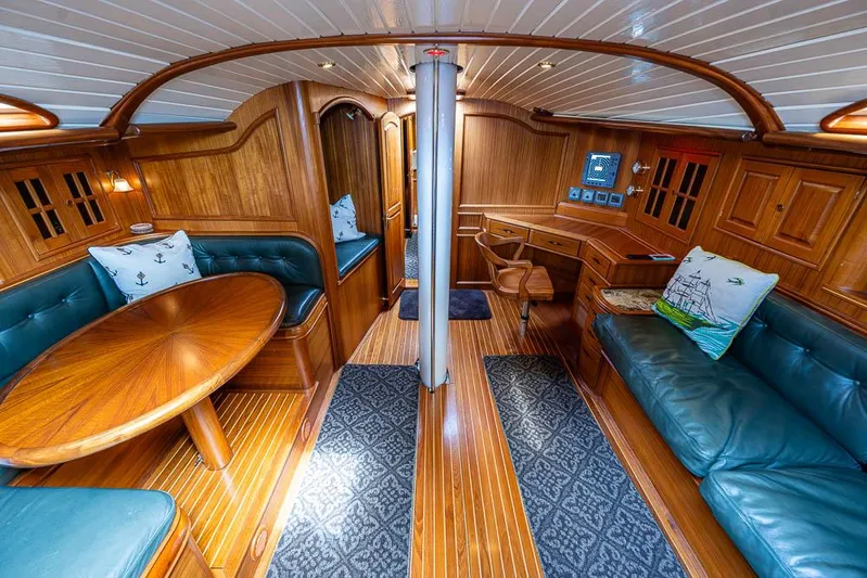 Koh - I - Noor Yacht Photos Pics Luxurious 1974 C&C 61 yacht interior with wood finish and leather seating.