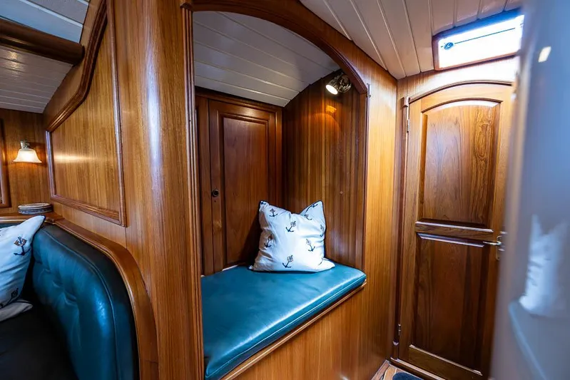 Koh - I - Noor Yacht Photos Pics 1974 C&C 61 yacht interior with wooden paneling and cozy seating area.