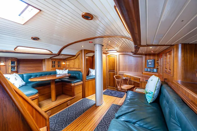 Koh - I - Noor Yacht Photos Pics Luxurious 1974 C&C 61 yacht interior with elegant wood paneling and plush seating.