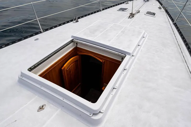 Koh - I - Noor Yacht Photos Pics 1974 C&C 61 yacht deck with open hatch, revealing wooden interior.