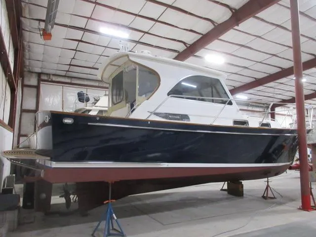  Yacht Photos Pics 2003 Legacy Yachts 34 Sedan in indoor storage facility.