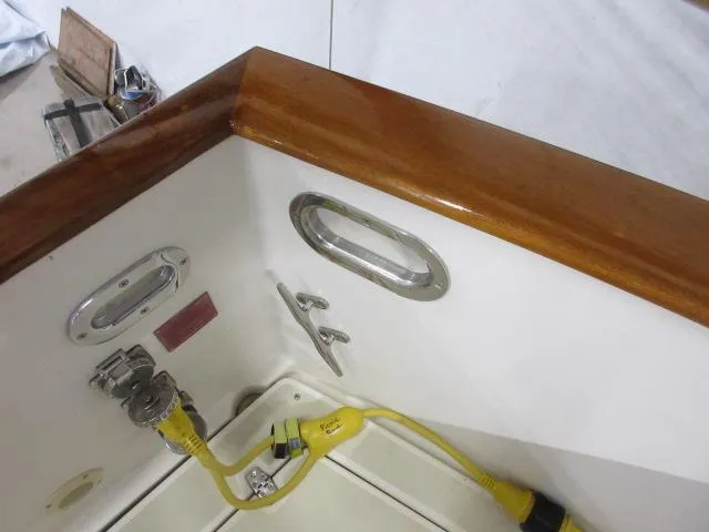  Yacht Photos Pics 2003 Legacy Yachts 34 Sedan boat deck with wooden trim and electrical connections.