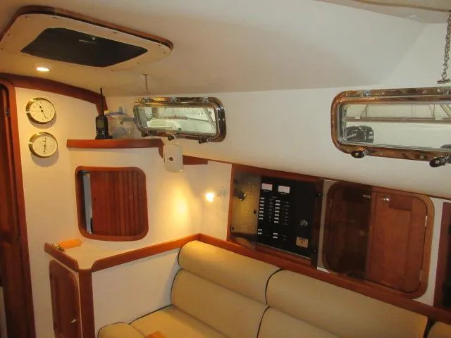  Yacht Photos Pics Interior of 2003 Legacy Yachts 34 Sedan with beige seating and wooden accents.
