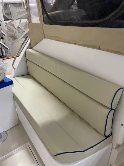  Yacht Photos Pics 2003 Legacy Yachts 34 Sedan interior with beige cushioned seating.