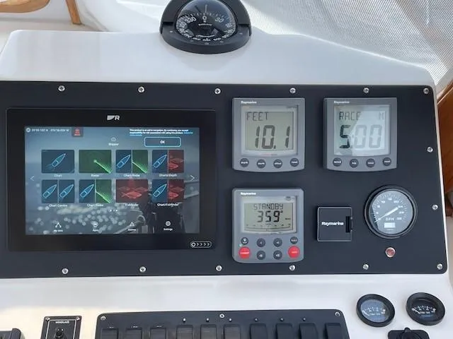  Yacht Photos Pics Control panel of a 2003 Legacy Yachts 34 Sedan with navigation instruments and digital displays.