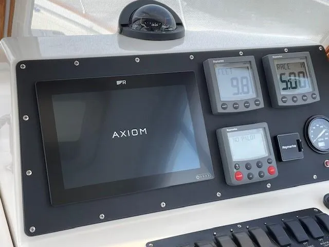  Yacht Photos Pics Control panel of 2003 Legacy Yachts 34 Sedan with Axiom display and navigation instruments.