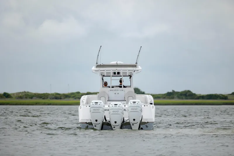  Yacht Photos Pics 2022 Sea Fox 368 Commander boat with triple engines on open water.