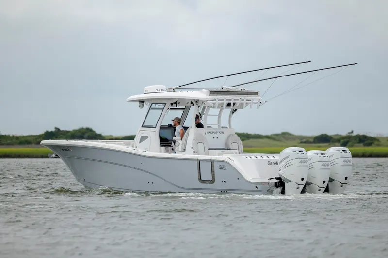  Yacht Photos Pics 2022 Sea Fox 368 Commander boat cruising on water with triple engines.