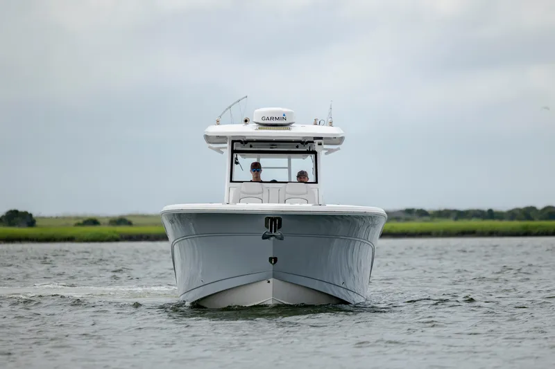  Yacht Photos Pics 2022 Sea Fox 368 Commander boat cruising on a calm waterway.