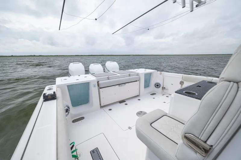  Yacht Photos Pics 2022 Sea Fox 368 Commander boat interior with ocean view, featuring seating and storage.