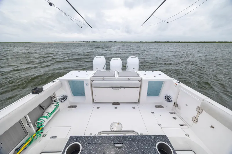  Yacht Photos Pics 2022 Sea Fox 368 Commander boat deck with triple engines on open water.