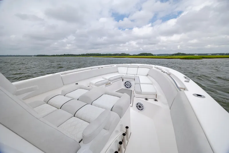  Yacht Photos Pics Luxurious seating on 2022 Sea Fox 368 Commander boat, cruising on a serene waterway.