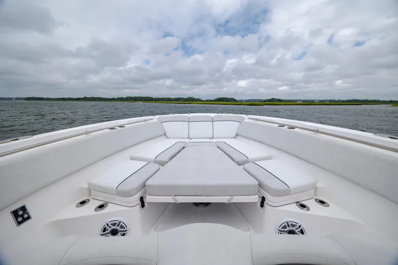  Yacht Photos Pics 2022 Sea Fox 368 Commander boat interior with cushioned seating on open water.