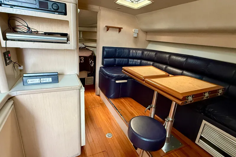  Yacht Photos Pics Interior of 1994 Tiara Yachts 4000 Express with seating, table, and entertainment system.